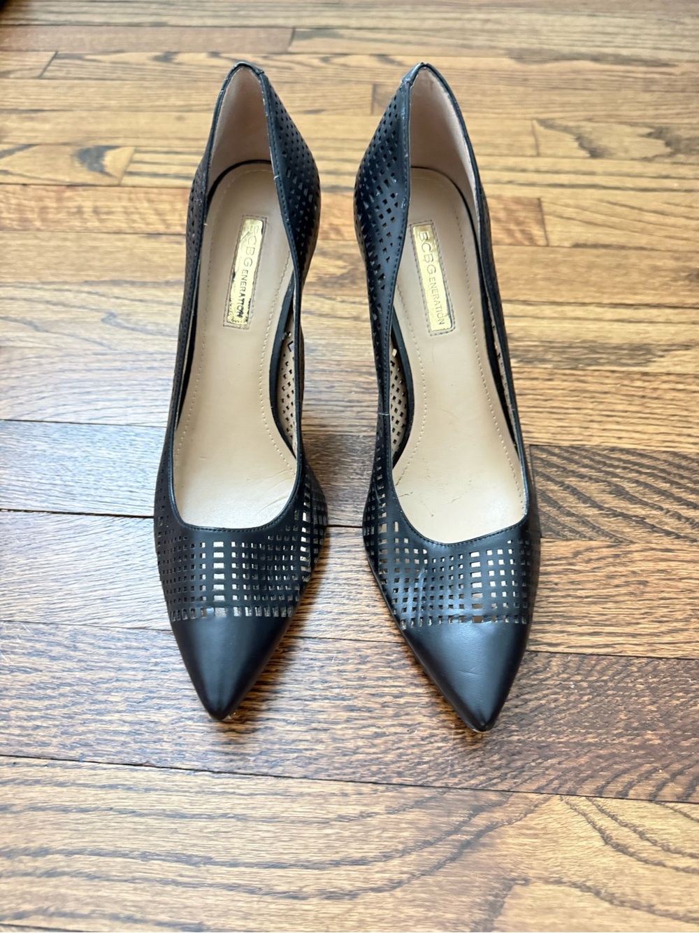 BCBGeneration Black Pointed-Toe Perforated Pumps